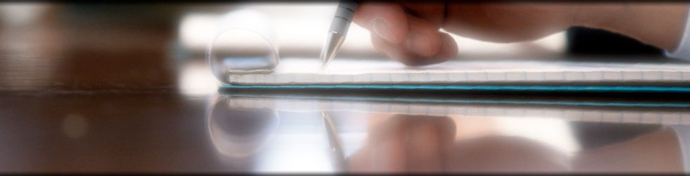 A closeup on a hand of a businessman writing a copyrights notice